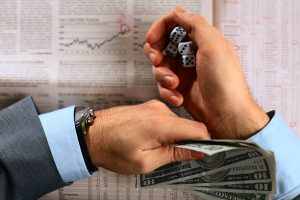 istockphoto 172124652 612x612 1 300x200 - Businessman hands throwing dices on financial charts.